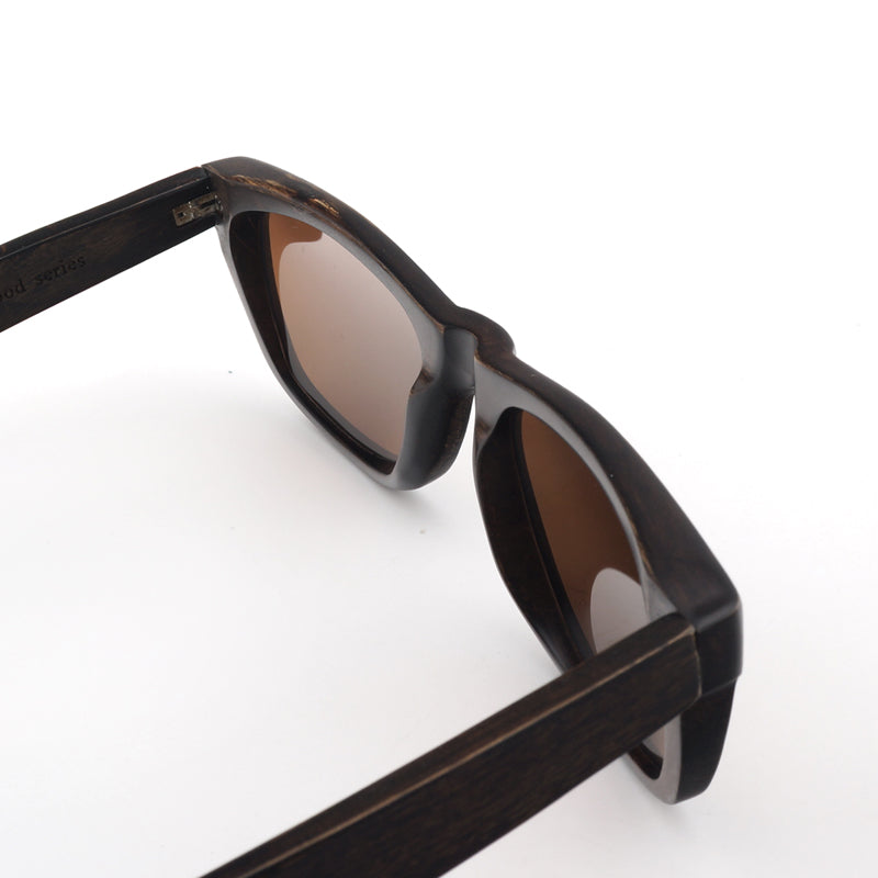 Dark wooden sunglasses with amber colored polarized lenses